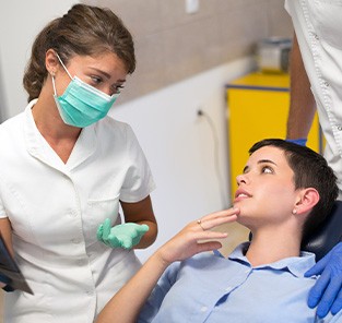 Dentist talking with patient about root canal results