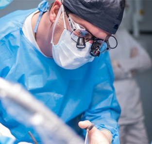 Dentist performing dental implant surgery in Norton Shores