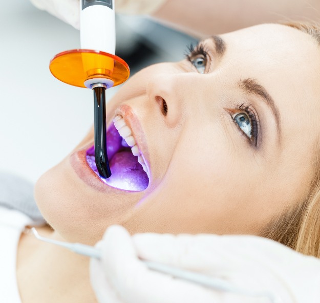 Patient receiving cosmetic dental bonding