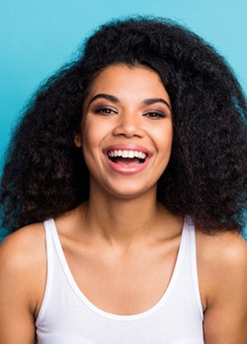 woman smiling with dental crowns in Norton Shores