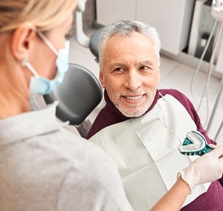 patient getting dentures in Norton Shores