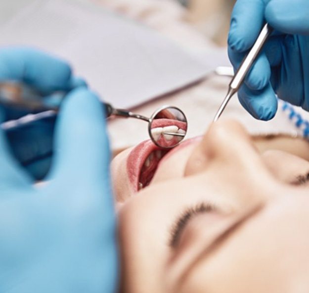 patient undergoing a dental checkup in Norton Shores