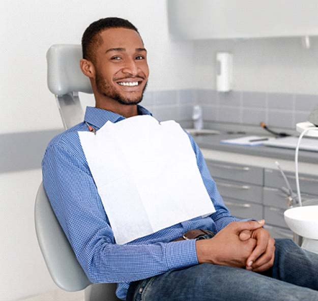 man sitting in the dental chair 