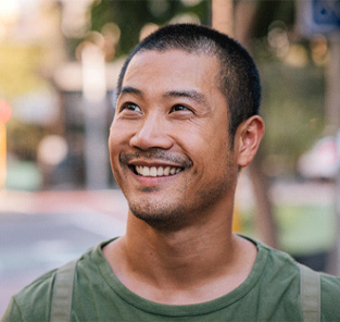 man smiling with dental implants in Norton Shores