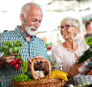 older couple shopping for healthy food