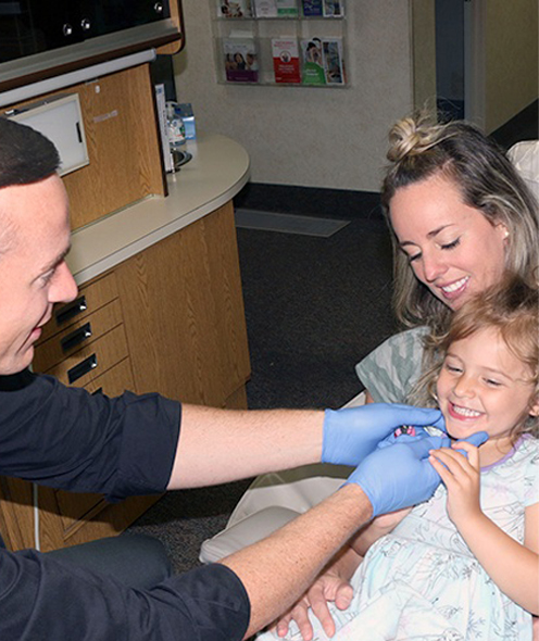 Norton Shores dentist treating a young girl patient
