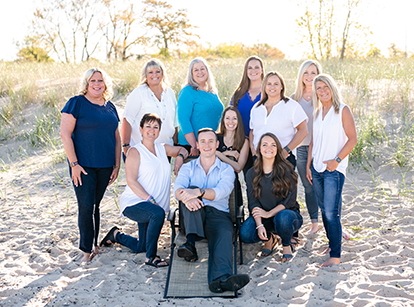 Norton Shores dental team smiling on the beach