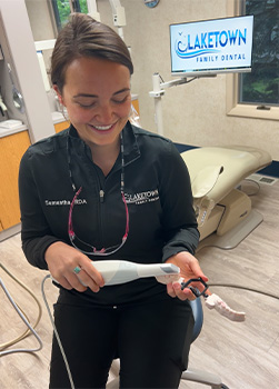 Patient laughing with Norton Shores dental team member