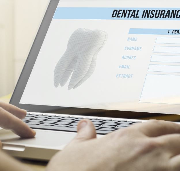 Dental team member completing dental insurance claim form