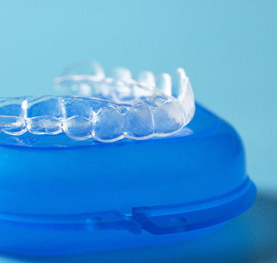 Close up of Invisalign in Norton Shores, MI on a blue case