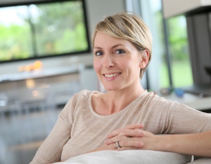 A photo of a smiling woman