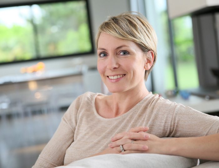 A photo of a smiling woman