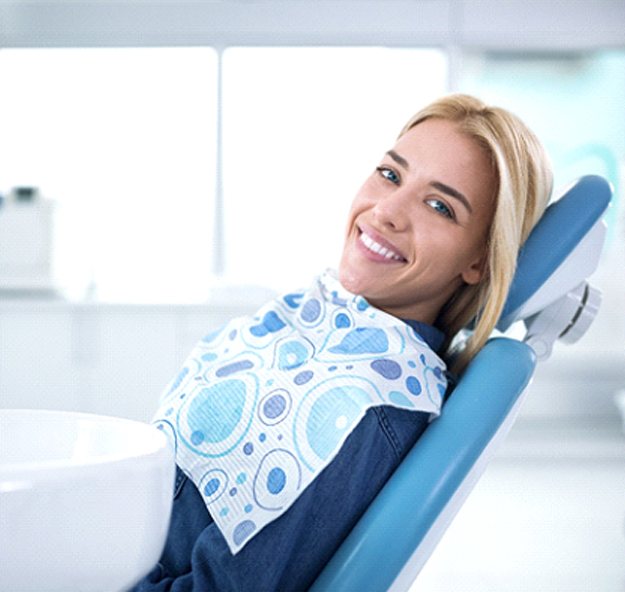 Smiling patient relaxing at dental office