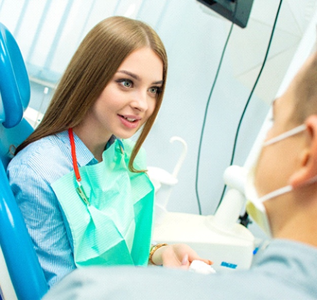 Patient talking to sedation dentist in Norton Shores