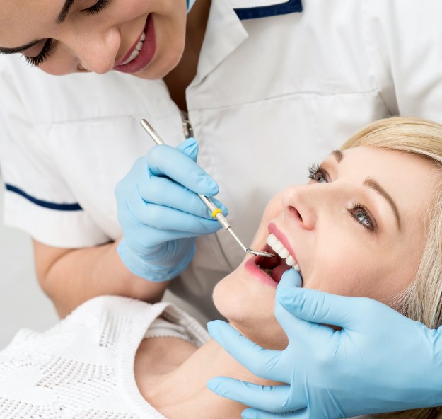 Patient receiving oral cancer screening