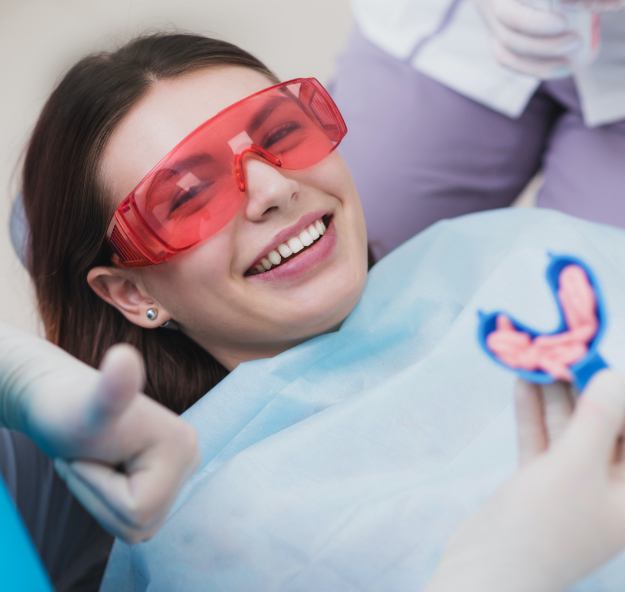 Patient smiling before fluoride treatment