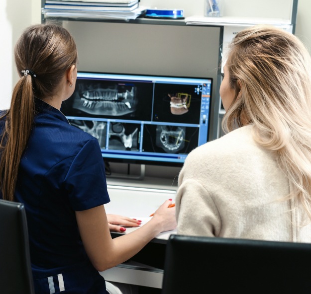 Dental team members reviewing digital x-rays