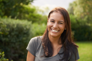 a person smiling while on summer vacation 