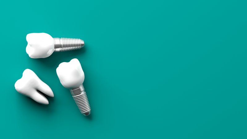 Dental implants on blue background