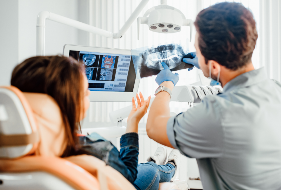 Dentist showing patient an x-ray