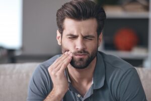 Man experiencing tooth pain